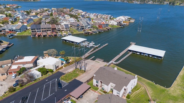 bird's eye view with a residential view and a water view