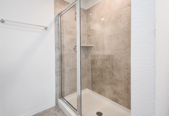 bathroom featuring a shower stall