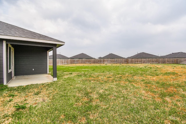 view of yard featuring a patio and a fenced backyard