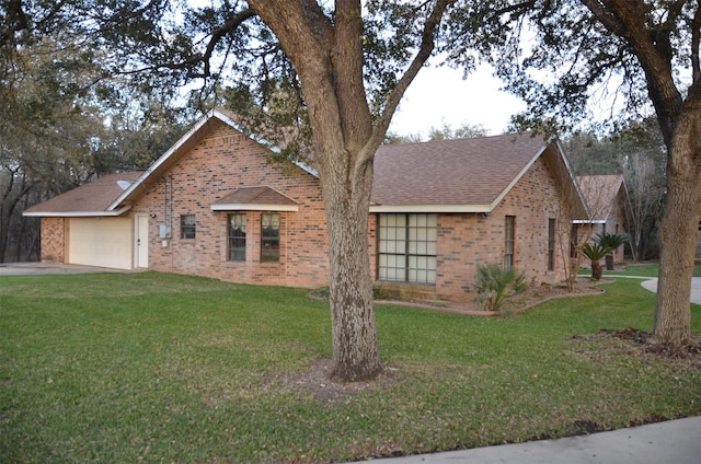 ranch-style house with brick siding and a front yard