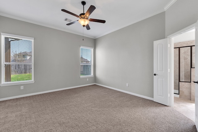 spare room featuring visible vents, light colored carpet, ceiling fan, and ornamental molding