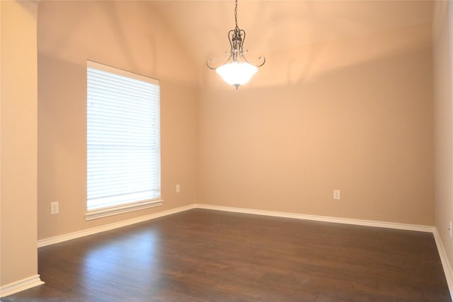 unfurnished room with baseboards, dark wood-type flooring, and lofted ceiling