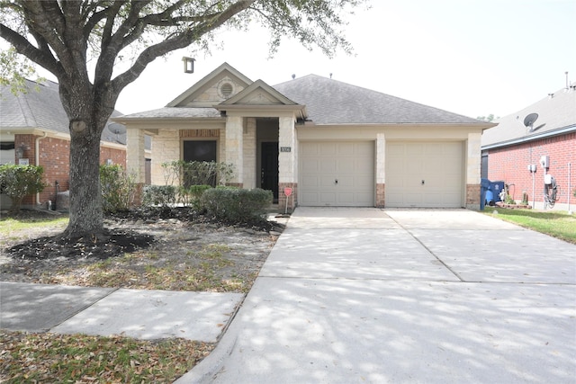 view of front facade with concrete driveway, a garage, stone siding, and a shingled roof