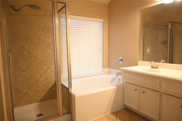 full bathroom with tile patterned floors, a stall shower, vanity, and a bath