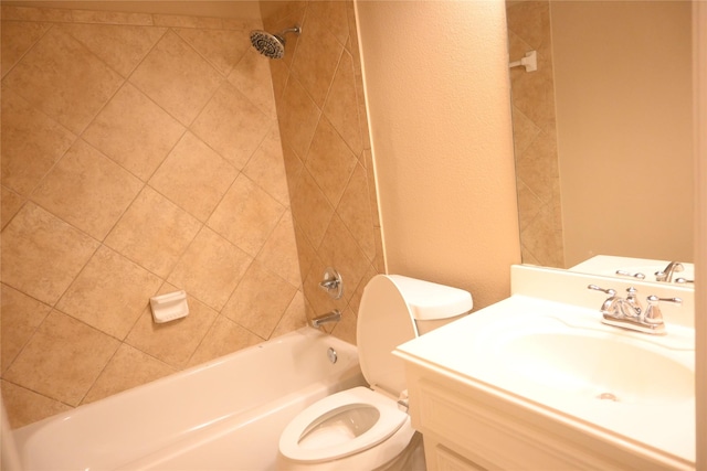 bathroom featuring vanity, toilet, shower / bathtub combination, and a textured wall