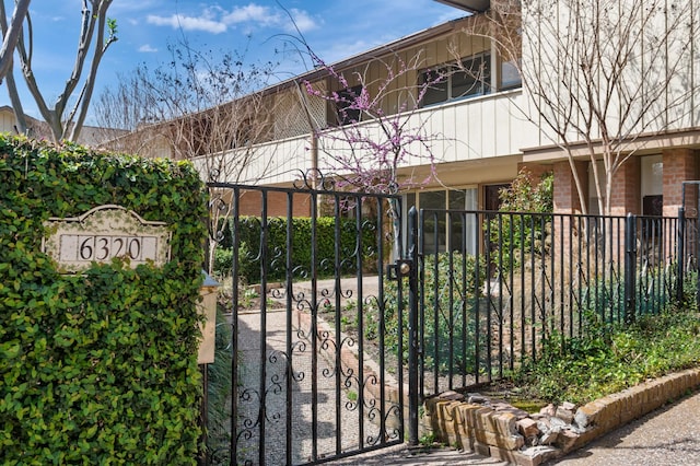 view of gate with fence