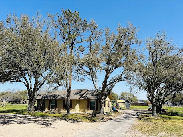 14431 Joyce St, Needville, TX 77461 - view of front of property featuring stucco siding and a front lawn