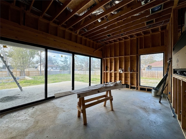 miscellaneous room with unfinished concrete floors