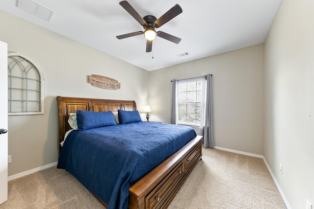 bedroom with light colored carpet, baseboards, and visible vents