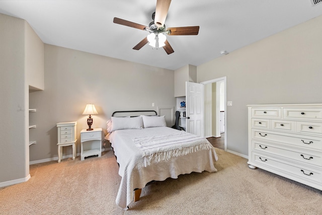 bedroom with baseboards, a ceiling fan, and carpet
