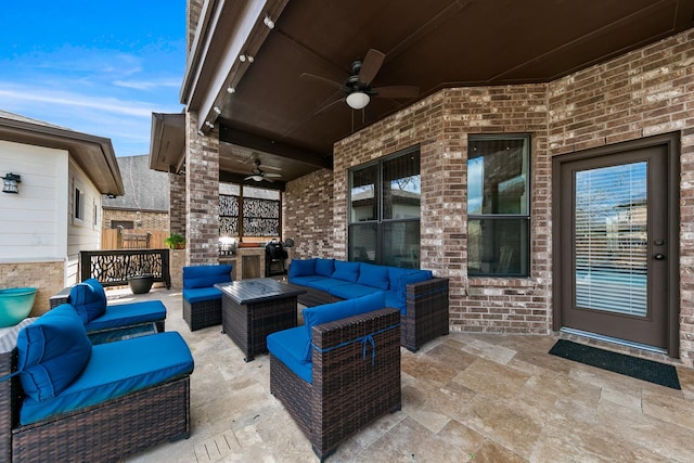 view of patio with ceiling fan and an outdoor living space