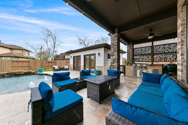 view of patio with an outdoor kitchen, an outdoor hangout area, a fenced backyard, french doors, and a grill
