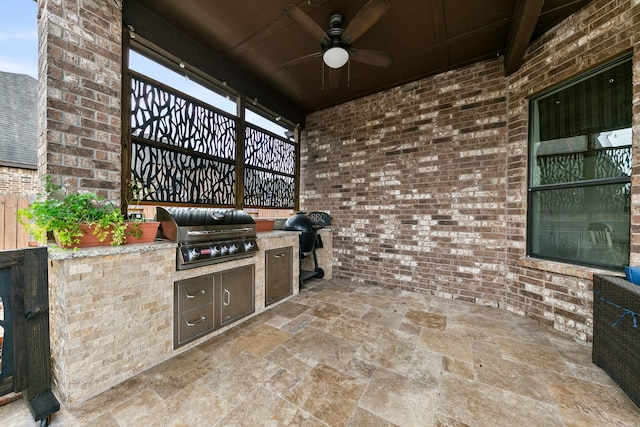 view of patio with a ceiling fan, a grill, and exterior kitchen
