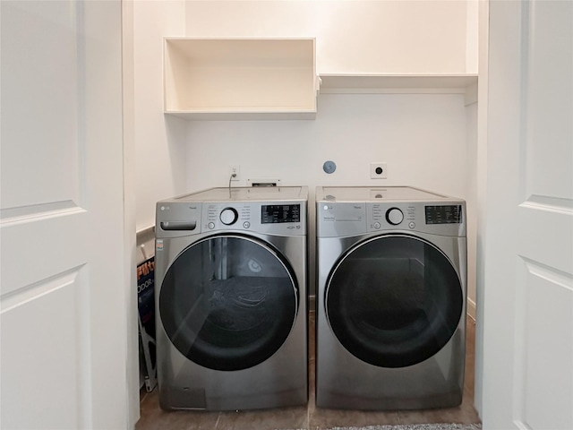 laundry room with independent washer and dryer