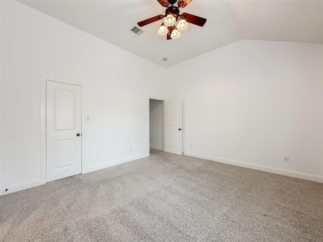 unfurnished room with visible vents, light colored carpet, baseboards, and a ceiling fan