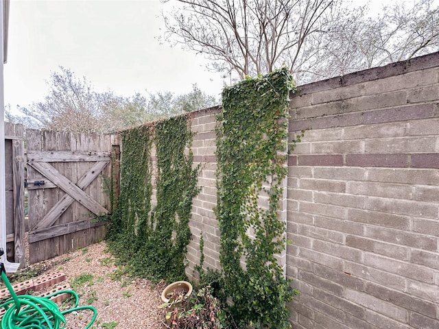 view of yard with a gate and fence