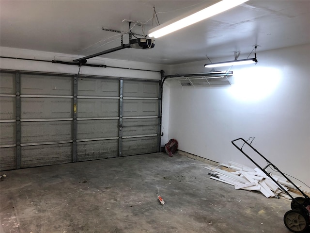 garage featuring a garage door opener