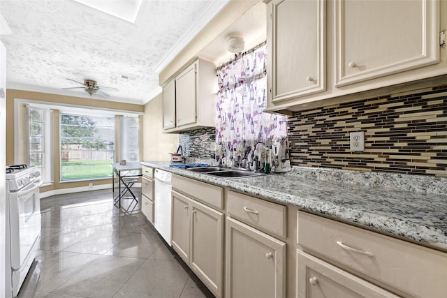 8639 Pearl Point St, Houston, TX 77044 - kitchen with white appliances, ornamental molding, a ceiling fan, light tile patterned flooring, and tasteful backsplash