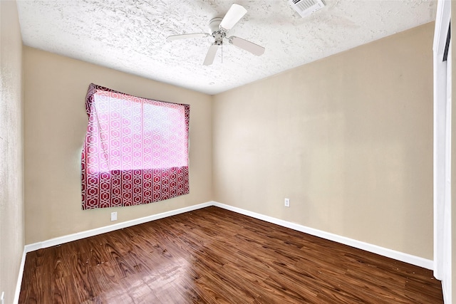 8639 Pearl Point St, Houston, TX 77044 - empty room with dark wood finished floors, a textured ceiling, and a ceiling fan