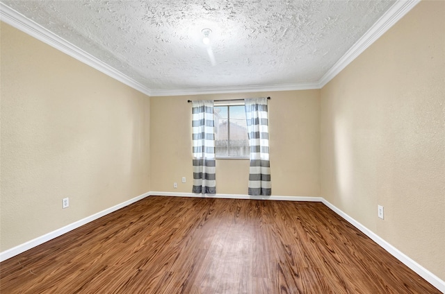8639 Pearl Point St, Houston, TX 77044 - spare room featuring wood finished floors, a textured ceiling, and ornamental molding