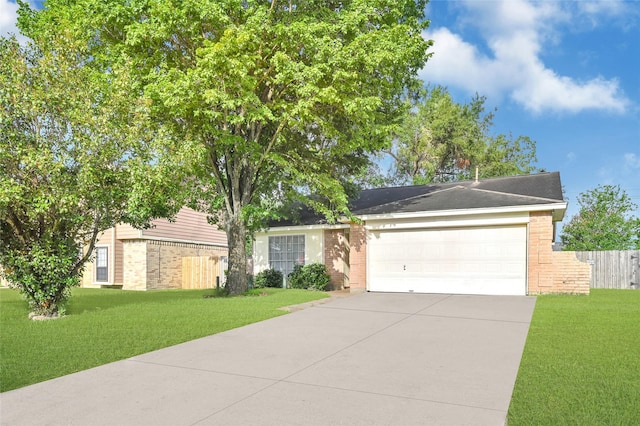 8639 Pearl Point St, Houston, TX 77044 - view of front of property featuring brick siding, concrete driveway, and a garage