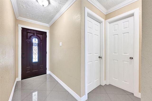 8639 Pearl Point St, Houston, TX 77044 - entryway featuring light tile patterned floors, a textured wall, ornamental molding, and a textured ceiling