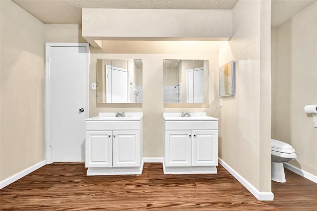 8639 Pearl Point St, Houston, TX 77044 - bathroom featuring wood finished floors and two vanities
