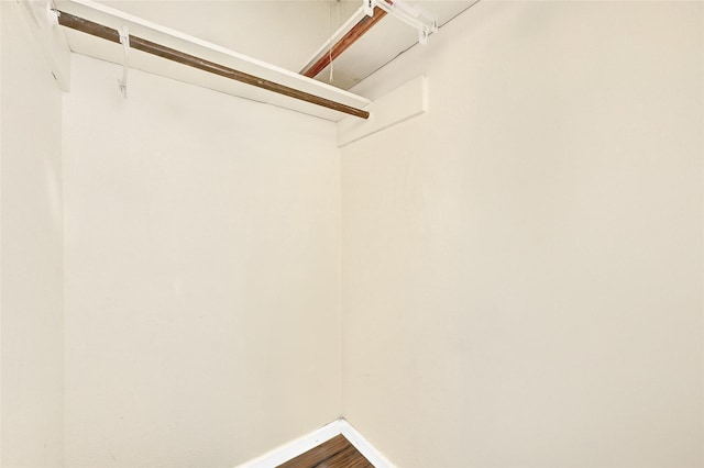 8639 Pearl Point St, Houston, TX 77044 - spacious closet featuring dark wood-style flooring