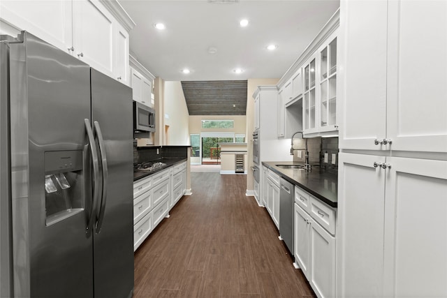 148 Sugarberry Cir, Houston, TX 77024 - kitchen with decorative backsplash, dark countertops, recessed lighting, a sink, and appliances with stainless steel finishes