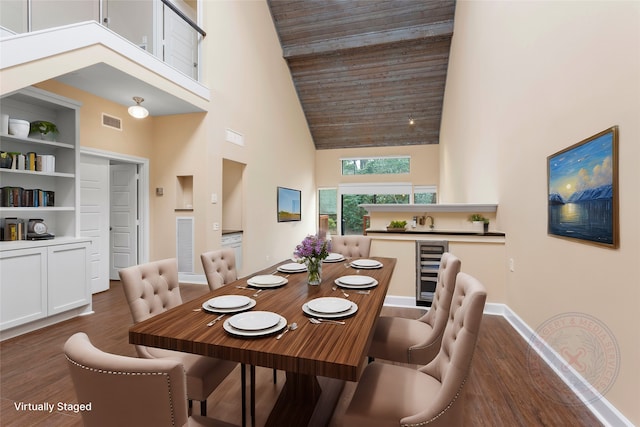 148 Sugarberry Cir, Houston, TX 77024 - dining room featuring visible vents, dark wood finished floors, high vaulted ceiling, baseboards, and wine cooler