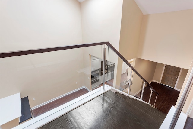 148 Sugarberry Cir, Houston, TX 77024 - stairs with baseboards and wood finished floors