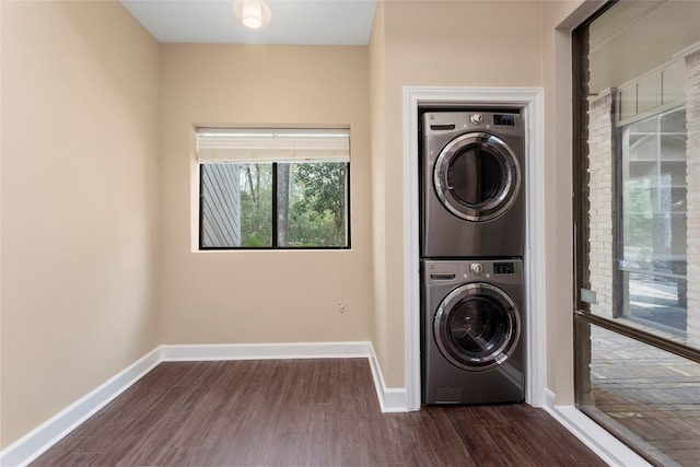 148 Sugarberry Cir, Houston, TX 77024 - laundry area featuring baseboards, laundry area, stacked washer and dryer, and dark wood-style floors