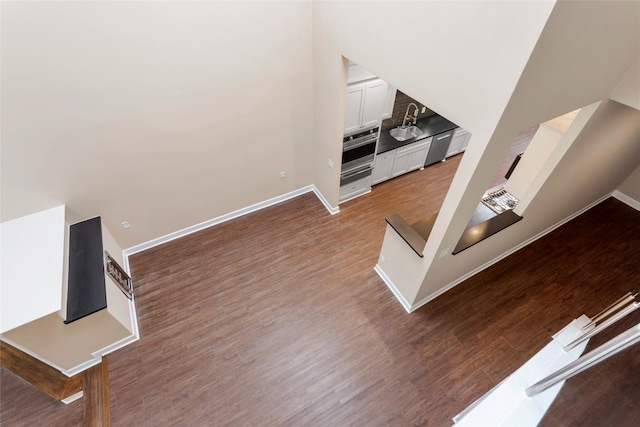 148 Sugarberry Cir, Houston, TX 77024 - staircase with baseboards and wood finished floors
