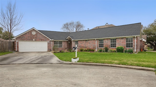 ranch-style home with concrete driveway, a front yard, a shingled roof, a garage, and brick siding