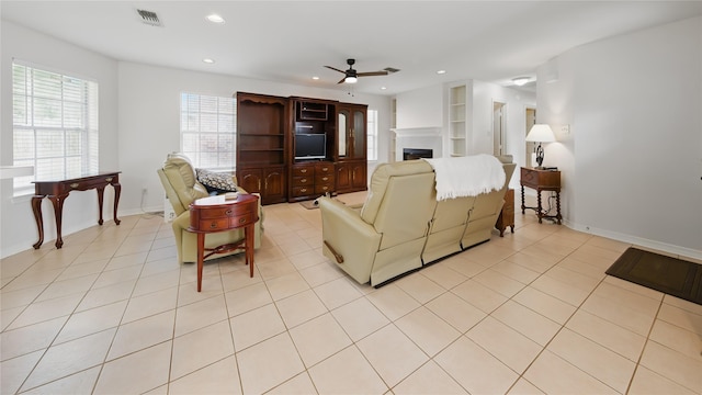 living room with visible vents, ceiling fan, recessed lighting, a fireplace, and light tile patterned flooring