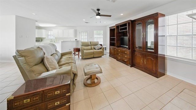 living area featuring visible vents, recessed lighting, light tile patterned flooring, baseboards, and ceiling fan