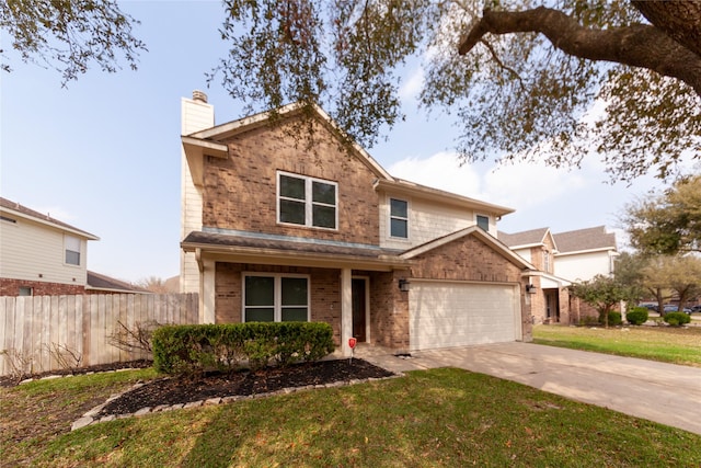 traditional-style house with a front yard, fence, driveway, a chimney, and brick siding