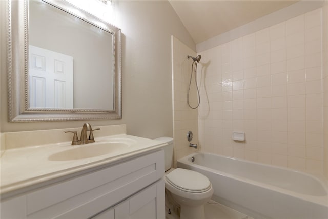 bathroom featuring toilet, vanity, bathing tub / shower combination, and vaulted ceiling