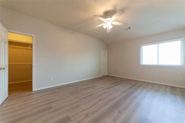 unfurnished bedroom featuring visible vents, baseboards, and light wood-style floors