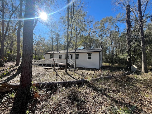 rear view of property with a deck