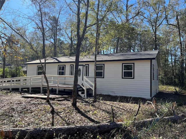 view of front of home featuring a wooden deck