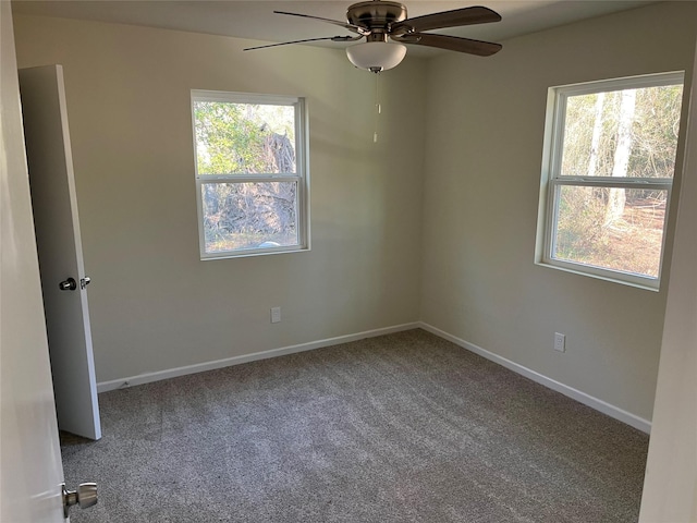 empty room featuring baseboards, a ceiling fan, and carpet floors