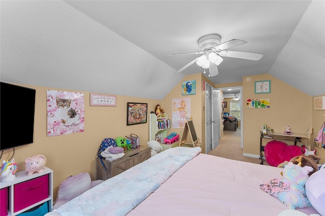 carpeted bedroom featuring ceiling fan, baseboards, and lofted ceiling