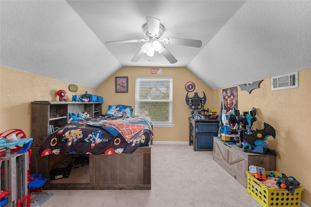 bedroom featuring visible vents, a textured ceiling, carpet floors, lofted ceiling, and a textured wall