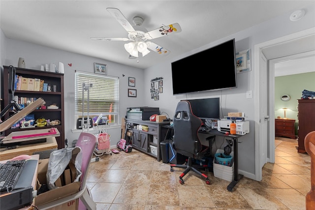 office area featuring baseboards and a ceiling fan