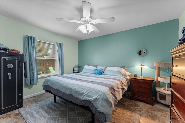 bedroom featuring a ceiling fan and baseboards