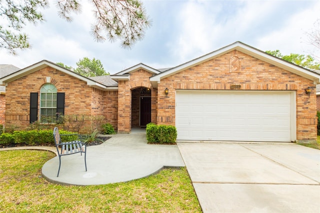 ranch-style home featuring a garage, brick siding, and driveway