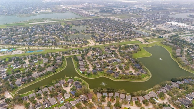 birds eye view of property featuring a residential view and a water view