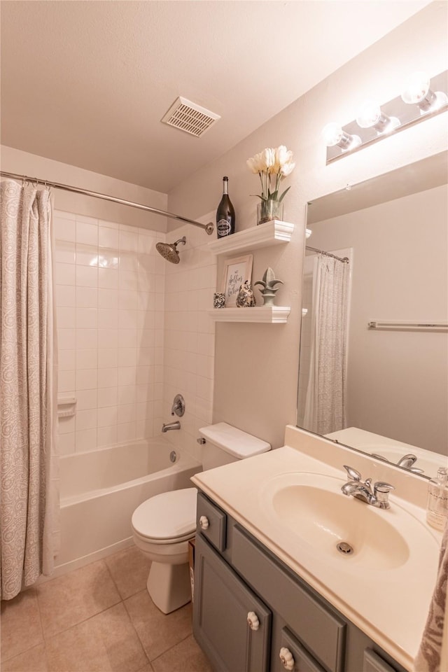 bathroom with tile patterned floors, visible vents, toilet, shower / tub combo, and vanity