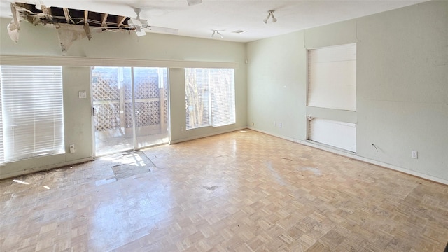 unfurnished room with a ceiling fan